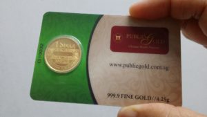 Dinar emas 24k Public Gold di'seal' bersama sijil ketulenan.